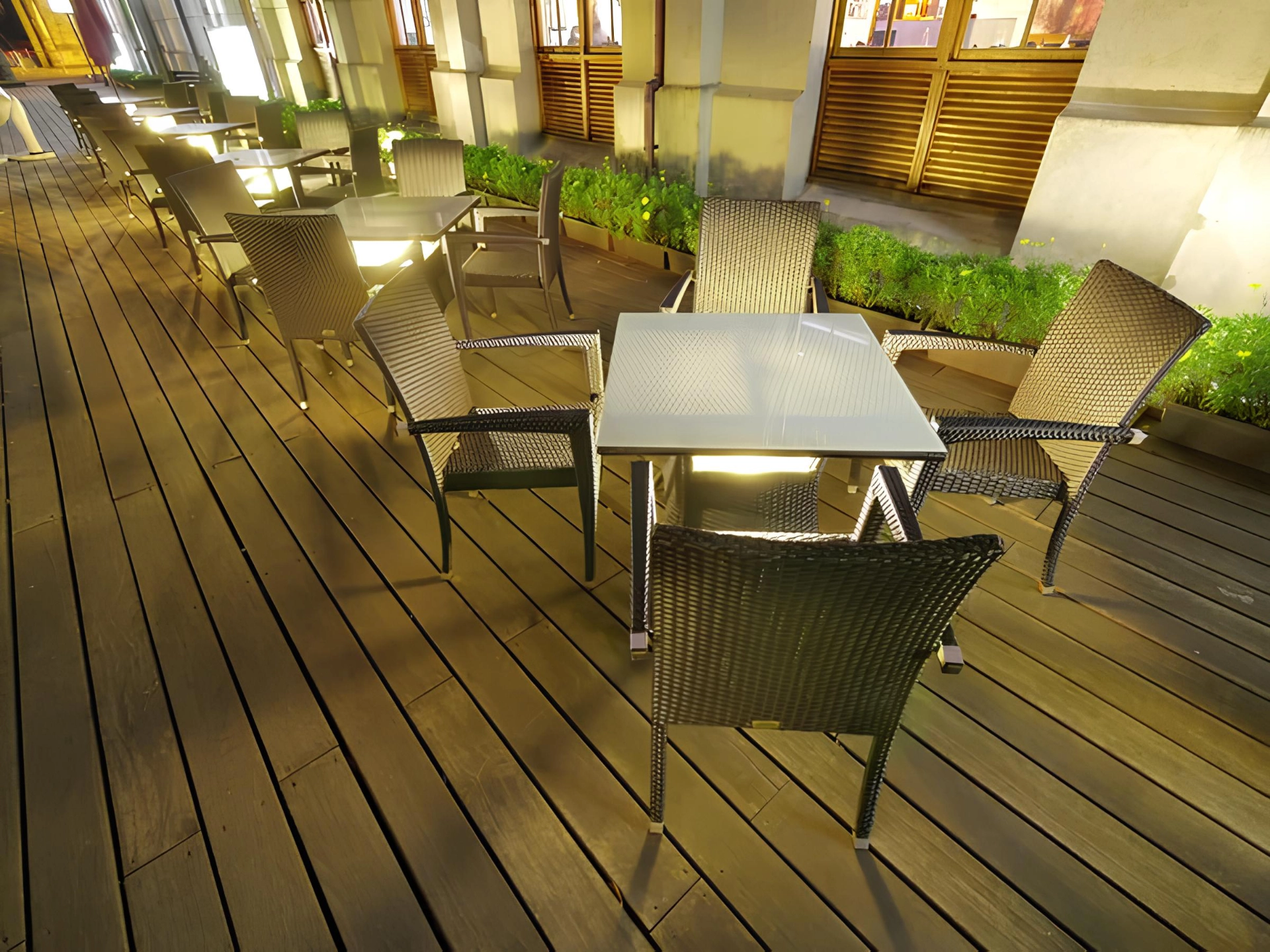 Commercial wooden deck with tables and chairs